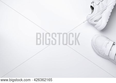 Mock Up Flat Lay Two White Sneakers On The Side In The Corner With Copy Space Isolated On A White Ba