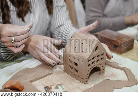 Women's Hands Knead Clay, Drawing Elements Of The Product. Production Of Ceramic Products At The Mas
