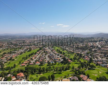 Aerial View Of Residential Neighborhood Surrounded By Golf And Valley During Sunny Day In Rancho Ber