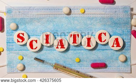 Wooden Cube With Text Sciatica. Medical Concept. Background.