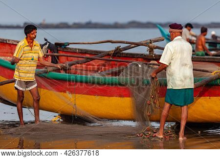 Morjim, North Goa, India , 29 March 2016 Local Fishermen Are Considering The Catch