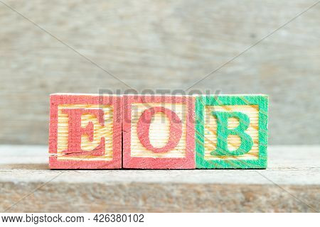 Color Alphabet Letter Block In Word Eob (abbreviation Of End Of Business) On Wood Background