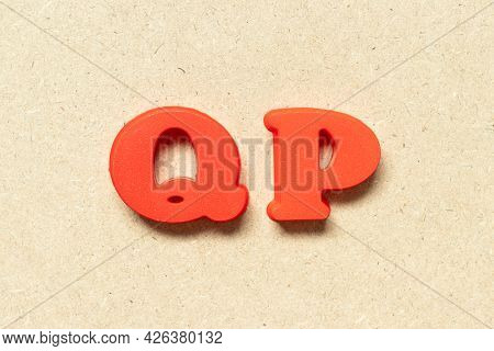 Plastic Alphabet Letter In Word Qp (abbreviation Of Quality Procedure) On Wood Background