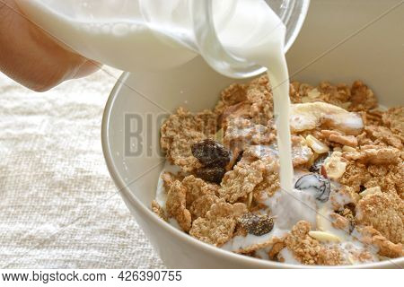 Fruit And Fiber Cereal On A Bowl With Milk In A Bowl.  The Concept Of Healthy Breakfast, Healthy Foo