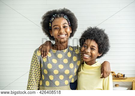 Happy Kids.two Cute Adorable Siblings African American Children Hug The Neck And Smile, Older Sister