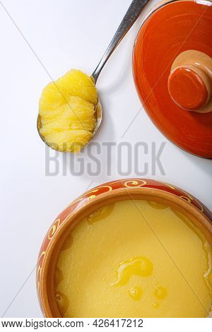 Pure Or Desi Ghee Also Known As Clarified Liquid Butter. Pure Or Desi Ghee In Ceramic Bowls On A Whi
