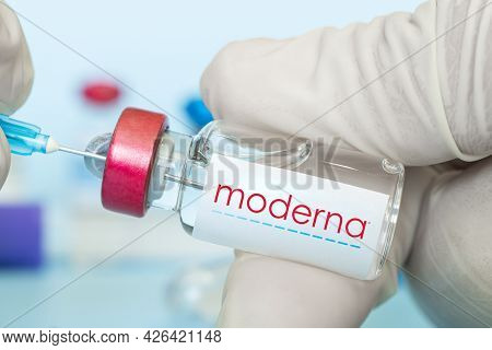 Glass Ampoule With A Clear Liquid On A Blue Background With The Logo Of A Pharmaceutical Company Mod