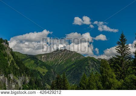 Summer Valley With Grossarler Ache Small River And Blue Cloudy Sky