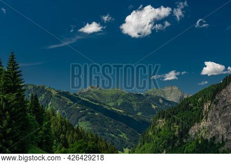 Summer Valley With Grossarler Ache Small River And Blue Cloudy Sky