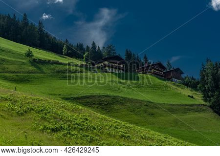 Summer Valley With Grossarler Ache Small River And Blue Cloudy Sky