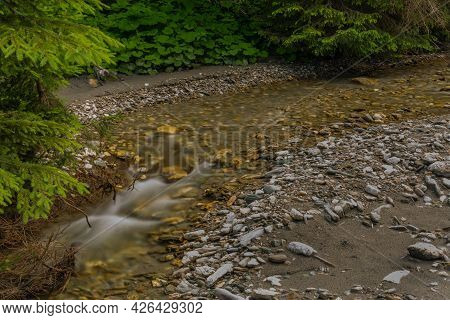 Nice Color Clean Creek Near Huttschag Village In Summer Hot Day