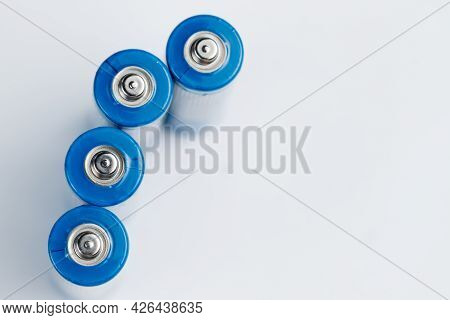 Macro Photo Of Batteries For Electronic Devices On A White Background.