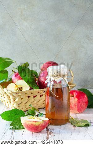 Healthy Organic Food. Apple Vinegar, A Bottle Of Apple Cider Vinegar On A Rustic Table. Copy Space.