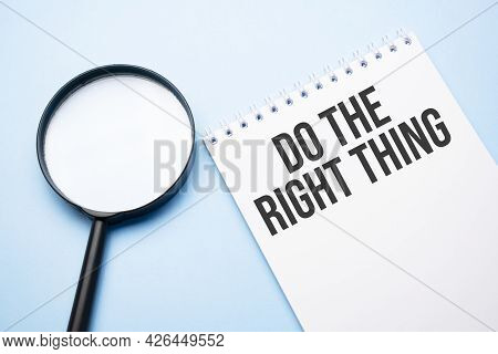Magnifying Glass Loupe With Sign Do The Right Thing Blue Table.