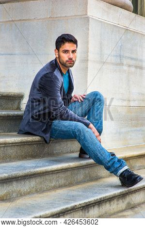 Dressing In A Dark Purple Woolen Blazer,  Blue Jeans And Black Leather Shoes, A Young Handsome Guy W