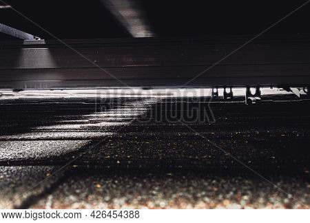 Gap Underneath Solar Panels And Asphalt Shingle Roof With Rails And Anchors Visible.
