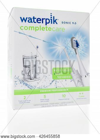 Winneconne, Wi -11 July 2021:  A Package Of Waterpik Water Flosser And Sonic Toothbrush On An Isolat