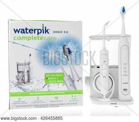 Winneconne, Wi -11 July 2021:  A Package Of Waterpik Water Flosser And Sonic Toothbrush On An Isolat