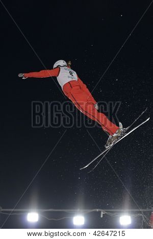 BUKOVEL, UKRAINE - FEBRUARY 23: Tanja Schaerer, Switzerland performs aerial skiing during Freestyle Ski World Cup in Bukovel, Ukraine on February 23, 2013.