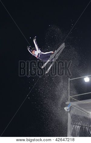 BUKOVEL, UKRAINE - FEBRUARY 23: Allison Lee, USA performs aerial skiing during Freestyle Ski World Cup in Bukovel, Ukraine on February 23, 2013.
