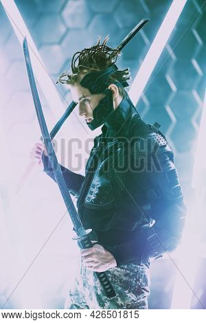Militant  warrior samurai in a protective suit fights with swords  in his hands in neon light. 