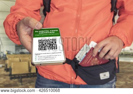 Hand Holding Smartphone Display On App Mobile Vaccinated Covid-19 Or Covi-pass Certificate, Immunity