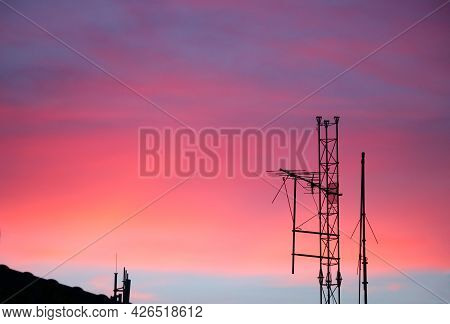Selective Focus At Digital Tv Transmission Tower On The Roof With Twighlight Background
