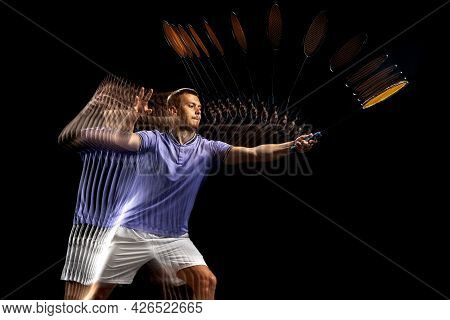 Portrait Of Young Man, Male Badminton Player, Shuttler In Motion And Action On Dark Background. Stro