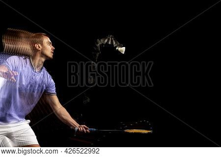Portrait Of Young Man, Male Badminton Player, Shuttler Playing Badminton On Dark Background. Strobos