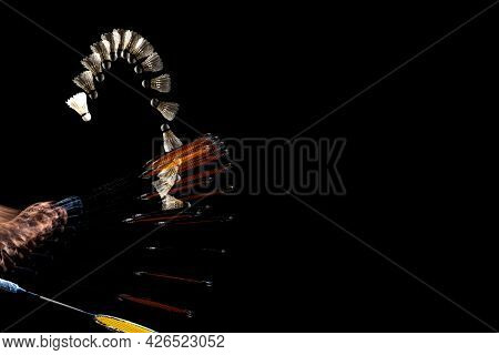 Close-up Male Hands With Badminton Racket And Shuttlecock Isolated Over Dak Studio Background With S