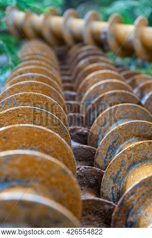 Augers For Drilling Geological Wells. Selective Focus Metal Augers.