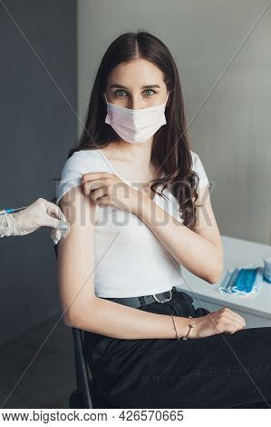 Woman Portrait After She Is Vaccinated. Young Woman In A Hospital Room.