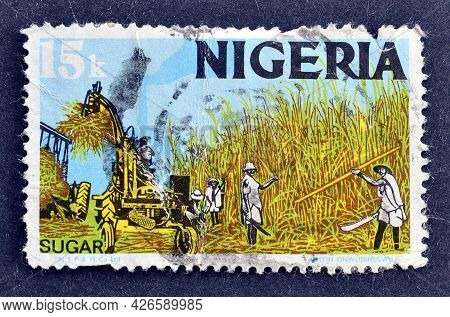 Nigeria - Circa 1973 : Cancelled Postage Stamp Printed By Nigeria, That Shows Sugar Harvest Producti