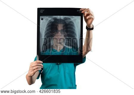 A Young Doctor Pulmonologist Looks At An X-ray Of The Patient's Breast Cell. Lung Health, Pneumonia,