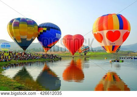 Chiang Rai-thailand Feb 16 2017: People And Tourists Are Watching Hot-air Balloon Show At The Singha