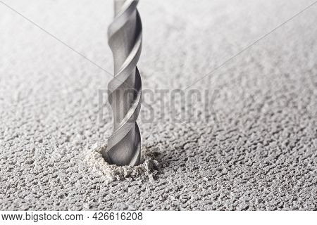 Drill Bit Make Holes In Concrete Wall With Industrial Drill. Building Work Industry.