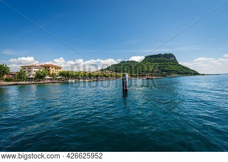 Beautiful Bay In Front Of The Small Town Of Garda, Tourist Resort On The Coast Of Lake Garda (lago D