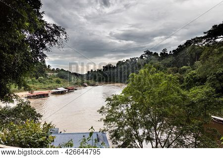View Of The Scenic Sungai Tembeling River With Floating Restaurants At Taman Negara National Park, P