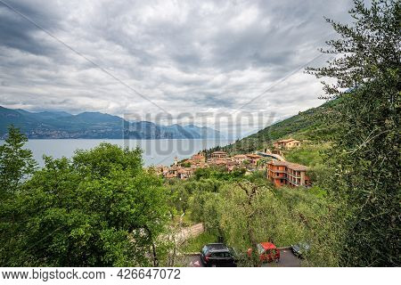Aerial View Of The Lake Garda (lago Di Garda) With The Small Village Of Castelletto Di Brenzone, Bre