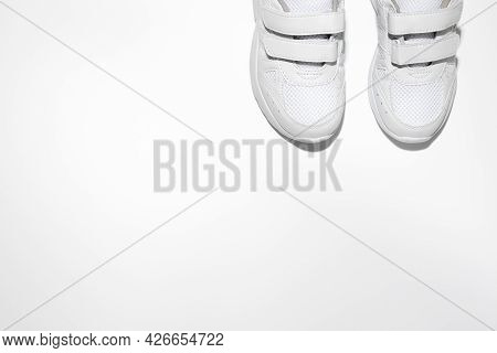 Mock Up Flat Lay Two White Womens Sneakers With Velcro Fasteners With Copy Space Isolated On A White
