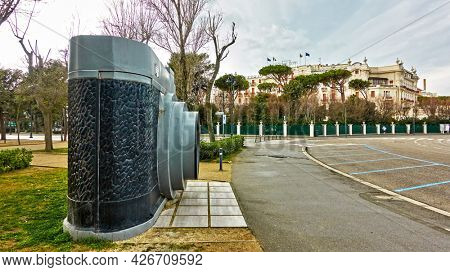 Rimini, Italy - March 2, 2020:  The Camera (1948) - Monument in Federico Fellini park in front of the Grand Hotel in Rimini. Landmark, panoramic cityscape