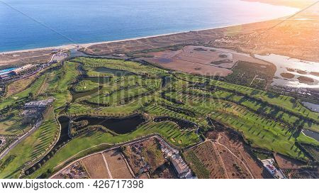 Green Golf Courses By The Sea. Salgados Beach. Portugal, Albufeira. Aerial View Sunny Day