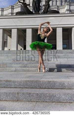 Ballet And Dance Concepts. Professional Caucasian Ballet Dancer In Green Tutu Dress Posing In Dance 