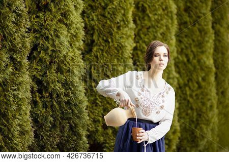 Young Sensual Housewife In Village Dress Picking Colorful Kidney Beans On Table In Countryside Envir