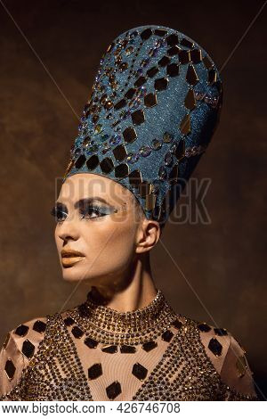 Close-up Beautiful Young Woman In Image Of Nefertiti In Art Performance Isolated On Brown Vintage Ba