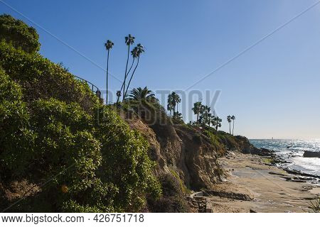 The View Of The San Clemente Waterfront At Sunrise During A Cloudless Day Featuring Rocky Beaches, T