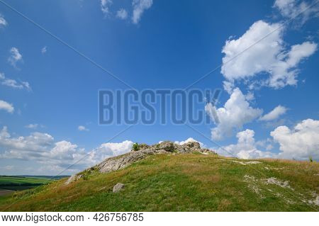 View to limestone toltres, rock residues of ancient coral reefs of dried Sarmatian sea at the North of Moldova