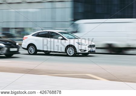 Moscow , Russia - April 2021: Ford Focus On The Road In Motion. Fast Speed Drive On City Road. Side 