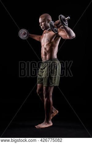 Side View Of An Athletic Adult Man Doing Shoulder Exercise
