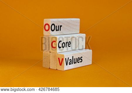 Our Core Values Symbol. Concept Words 'our Core Values' On Wooden Blocks On A Beautiful Orange Backg